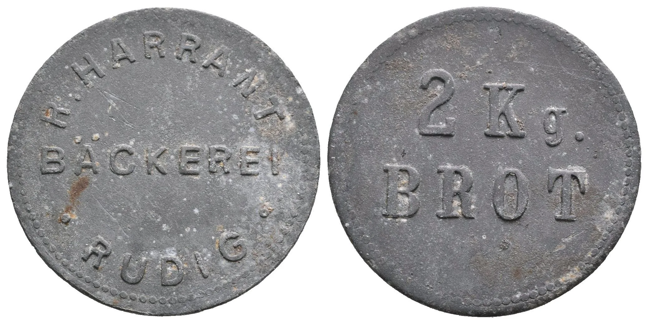 Vroutek / Rüdig - Pekárna R. Harrant, známka na 2 kg chleba. Zn 25 mm, — 1