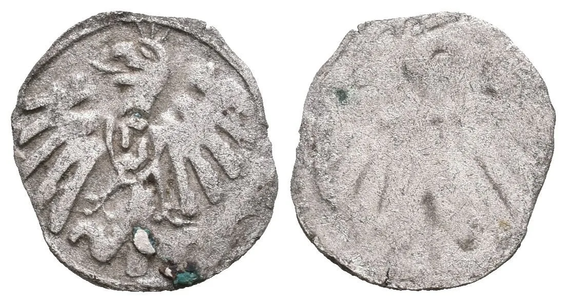 Kruhový peníz s korunovanou orlicí a s prsním štítkem s písmenem G (Georgius), — 1