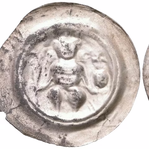Velký brakteát, Cach 684a, opis REX, viz Num. listy 65/2010-2, str. 59-64,