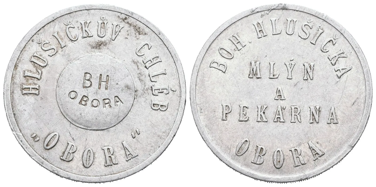 Obora - Mlýn a pekárna Bohuslav Hlušička, známka na chléb. Al 30 mm — 1