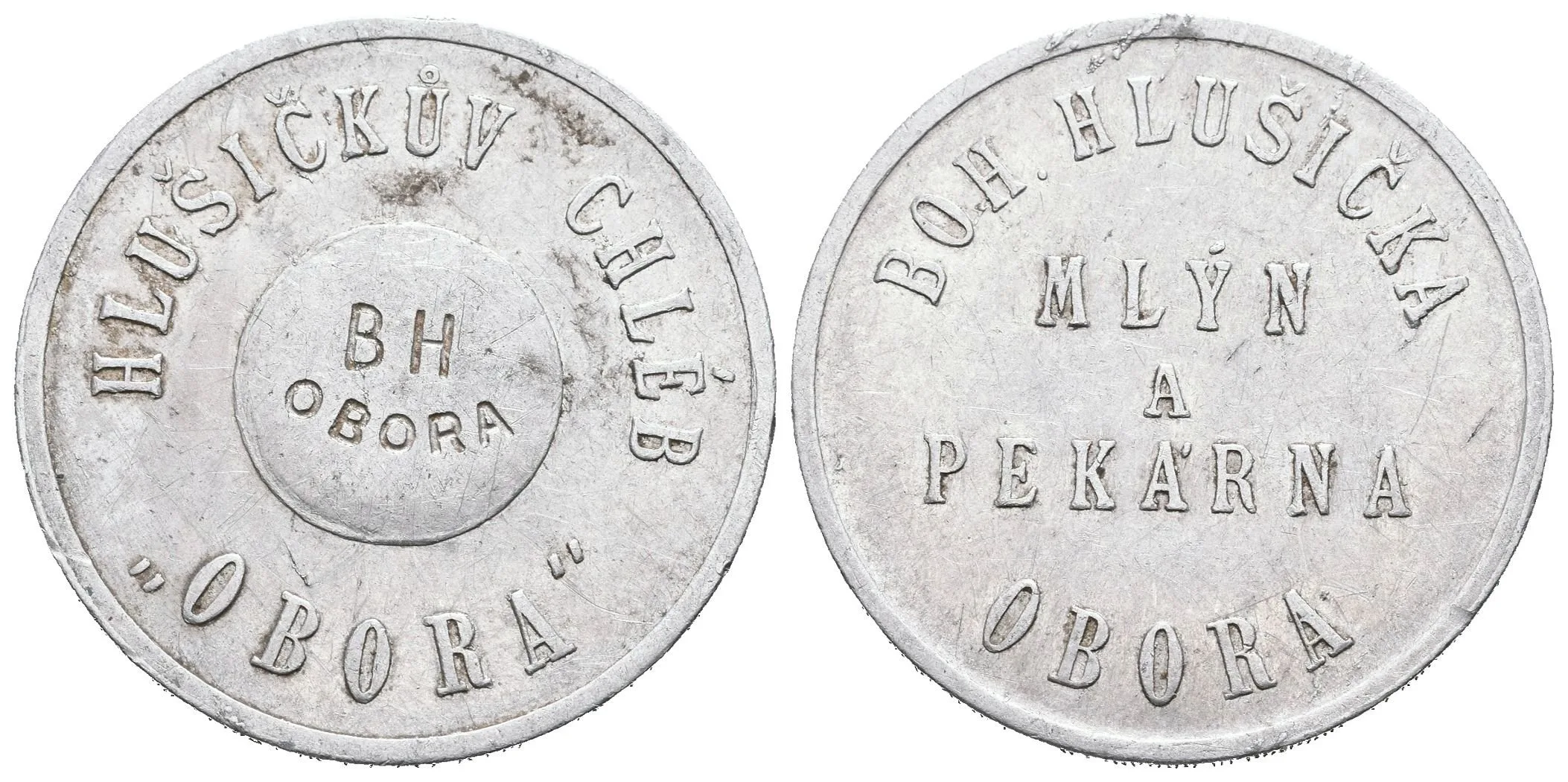 Obora - Mlýn a pekárna Bohuslav Hlušička, známka na chléb. Al 30 mm — 1
